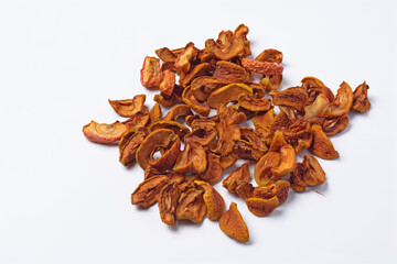 Pieces of dried apples on a white background close - up