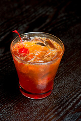 Cocktails. Traditional American drinks made by artisanal bartenders or mixologists in speakeasy & upscale bars or dives or taverns.Cocktails served in chilled cocktail glasses & garnished with fruit.