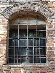 Fototapeta na wymiar Ferrara, Italy. Old window with railing.