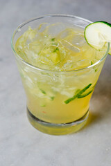 Margarita. Classic traditional Mexican cocktail. Made with Blanco tequila, fresh lime juice, agave syrup and orange juice. Served in salt rimmed tumbler over ice and garnished with a lime.