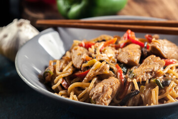 Chicken chow mein. Fried noodles with chicken and vegetables
