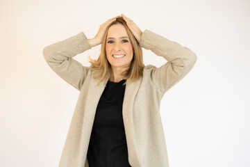 Image of shocked excited young lady standing isolated over white background. Looking camera.