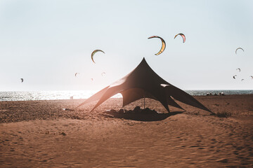 Colored tent for kite surfers on the sandy shores of the sea © Mediteraneo