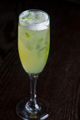 Margarita. Classic traditional Mexican cocktail. Made with Blanco tequila, fresh lime juice, agave syrup and orange juice. Served in salt rimmed tumbler over ice and garnished with a lime.