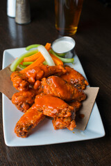 Chicken wings, classic american style bar/pub favorite fare: chicken wings served spicy buffalo and honey barbecue. Paired with classic ranch and blue cheese dipping sauce. 