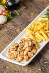 grilled cubed chicken with pasta and salad