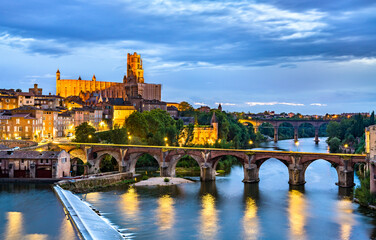 Albi featuring the Sainte-Cecile Cathedral and the Old Bridge over the river Tarn. UNESCO world heritage in France - obrazy, fototapety, plakaty