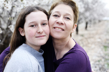 Portrait of beautiful woman and her teenager daughter