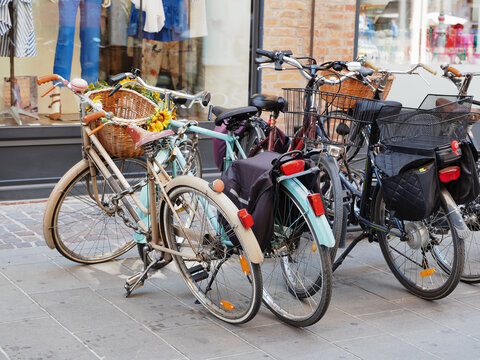 Ferrara, Italy. Bicycles parked in front of a shop.