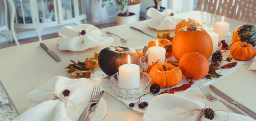 Festive table setting for Thanksgiving family home dinner. Fall composition with decorative...