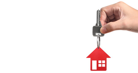 Real estate agent handing over house keys in hand, and coins