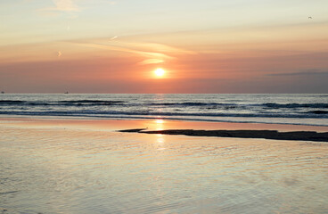 Colorful sunset over the North Sea at the beach of Noordwijk, Netherlands