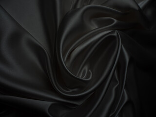 Beautiful elegant dark silver grey or black satin silk luxury cloth fabric texture, abstract background design.