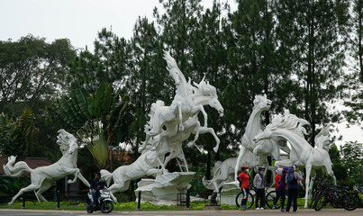 A cycling community crosses Jalan Raya Sawangan, Depok, West Java, Indonesia 18 October 2020.