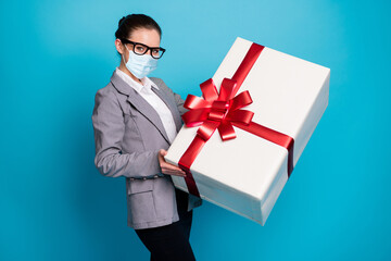 Photo of positive girl lawyer receive big huge gift box wear mask grey blazer jacket isolated over blue color background