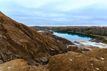 Fototapeta na wymiar Turquoise lake in the abandoned coal quarries near Konduki village, Tula oblast, Romantsevskie mountains.