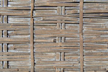 Dark old wood weave panoramic texture for wallpaper background. Panoramic old dark woven bamboo texture