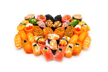 Set of sushi pieces with seafood and raw fish. Japanese sushi rolls, nigiri, sashimi, gunkan. Variety of eastern food slices with different seafood ingredients served and isolated on white background.