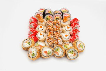 Set of sushi roll pieces with seafood and raw fish. Futomaki and tempura sushi rolls. Variety of eastern food slices with different seafood ingredients isolated on background. 
