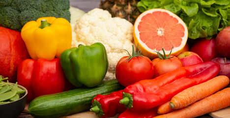 Group vegetables and Fruits Apples, grapes, oranges, and bananas in the wooden basket with carrots,...