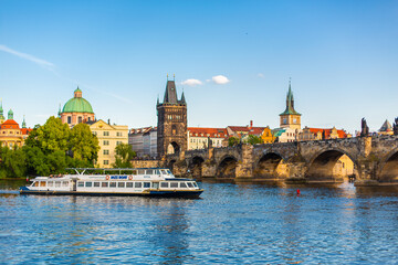 Fototapeta na wymiar Summer landscape of Prague view of the Ltava river and the famous Charles bridge