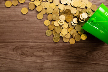Coins on a wooden table. The texture of the coins as a background of wealth and profit