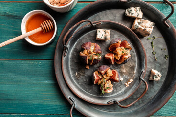 Delicious dessert made with figs fruit, cheese, nuts and honey. appetizer, ideal as an aperitif, catering, banner, menu, recipe, place for text