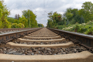 Close-up of railroad tracks leading straight forward to infinity