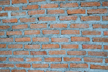 fresh brick wall at house construction site.