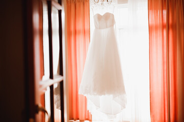 The perfect wedding dress in the room of the bride