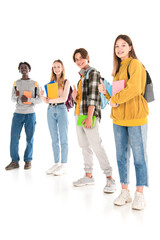 Fototapeta premium Multicultural teenagers with books and backpacks smiling at camera and showing like on white background