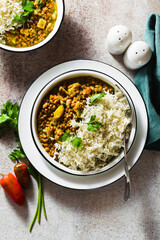 indian lentil dhal with vegetables and basmati rice on the table. healthy vegan Ayurvedic cuisine