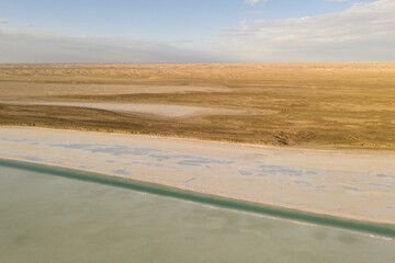 Salt lake with wide flatlands background.