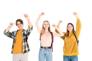 Smiling teenagers with backpacks showing yes gesture isolated on white