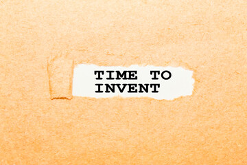 text TIME TO INVENT on a torn piece of paper, business concept