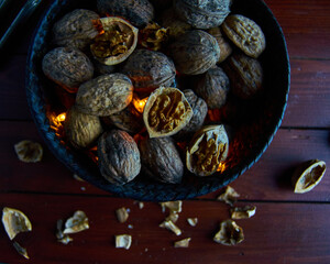 walnut in wood table in basket
