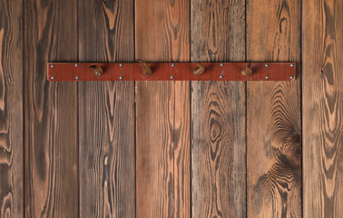 vintage wooden hanger on a wooden wall