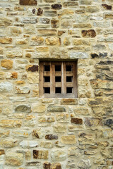 Fototapeta na wymiar Stone wall with wood window.