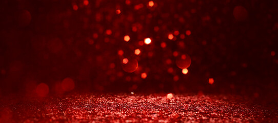 background of abstract red, gold and black glitter lights. defocused