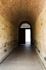 Empty corridor with the door open at the end.
