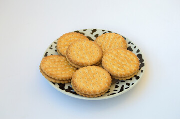 ceramic plate with Marie biscuit isolated on white background