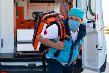 Emergency aid team preparing for emergency response to the patient in the ambulance