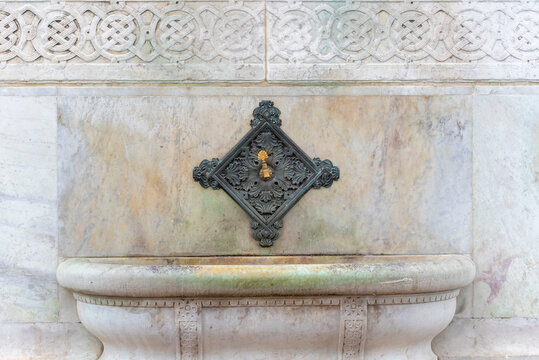 Old faucet or washbasin at mosque for ablution before praying in Istanbul, Turkey