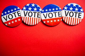 Vote buttons on red background with copy space. Election theme