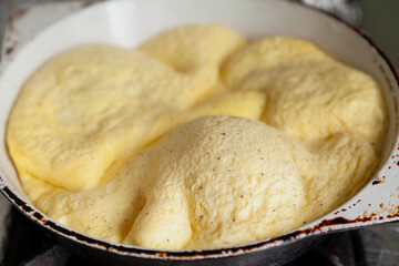 Appetizing omelette in frying pan