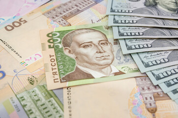 Currency ratio concept. 100 dollar bill and 500 Ukrainian hryvnia. Close-up.