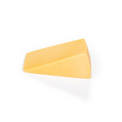 Shooting in the studio. A piece of yellow cheese, cut from the head. Close-up. On white background.
