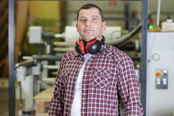 portrait of a man in a warehouse