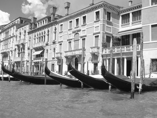 Gondola awaiting service in Venice, Italy. Black & white photography. Template for design of holiday greetings, decoration packaging, postcard, poster