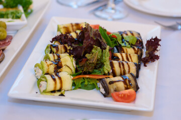 Eggplant stuffed on the table. Festive appetizer at the Banquet.